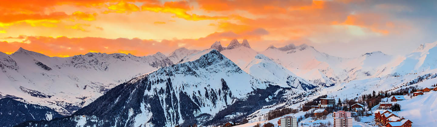 Winter sunrise landscape and ski resort in the French Alps