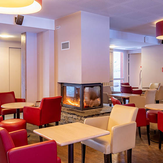 Eat and drink by the fireplace at the Village Club Miléade in Val Cenis, France